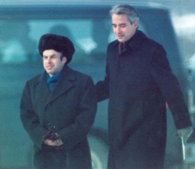 Soviet Jewish dissident Anatoly B. Shcharansky, left, is escorted by U.S. Ambassador Richard Burt after Shcharansky crossed the border between East Germany and West Berlin at Glienicke Bridge during an East-West spy and prisoner exchange on Feb. 11, 1986.